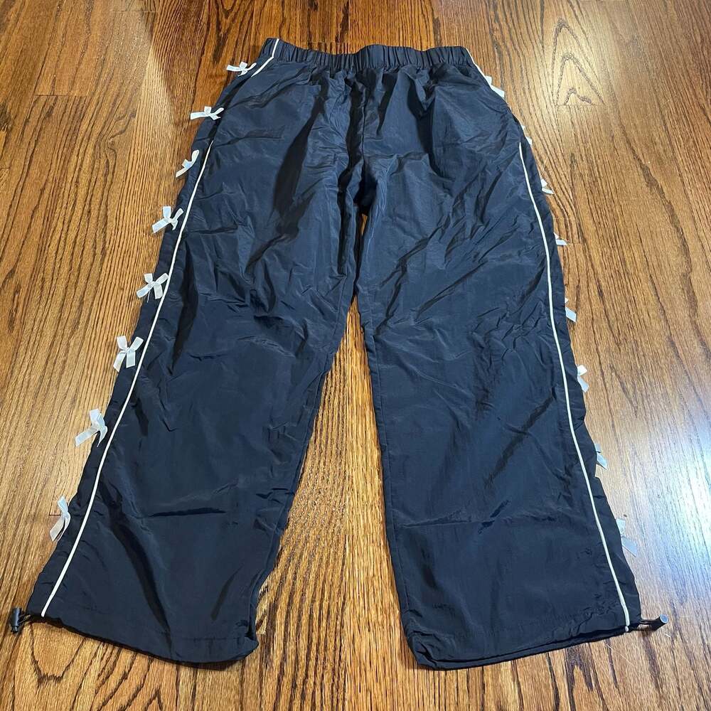 Cottagecore Whimsy Women's Black Nylon Athletic Pants with Side Bow Detail